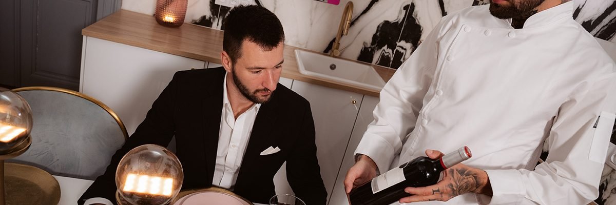 private chef serves couple their meal at the table