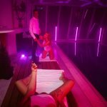 woman gives blowjob by the pool
