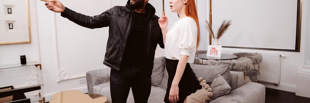 Black realtor Yves Morgan shows a beautiful client around a house.