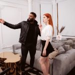 Black realtor Yves Morgan shows a beautiful client around a house.