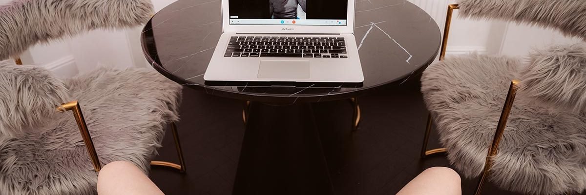 Woman masturbates watching a black man on her laptop.